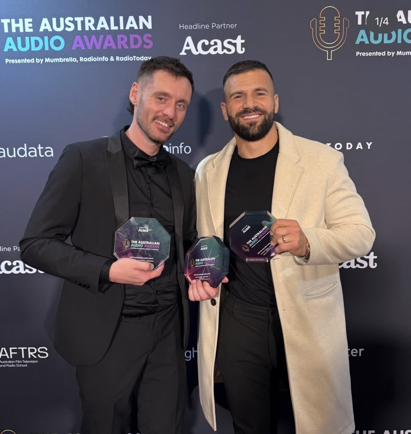 Josh Fox and Josh Mansour holding three Australian Audio Awards trophies at the 2026 Australian Audio Awards